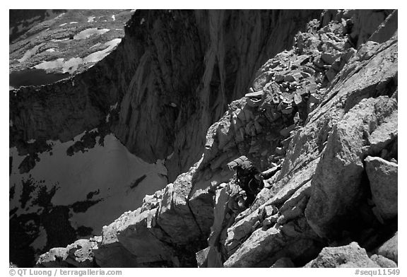 Mountaineer among broken rocks in the East face of Mt Whitney. Sequoia National Park, California