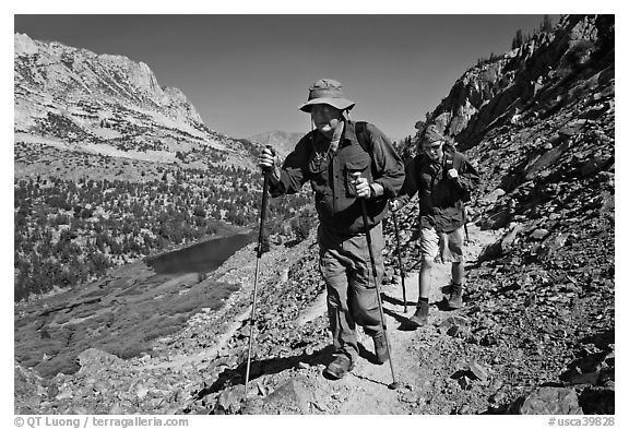 Father and son on trail above Long Lake, John Muir Wilderness. Kings Canyon National Park, California