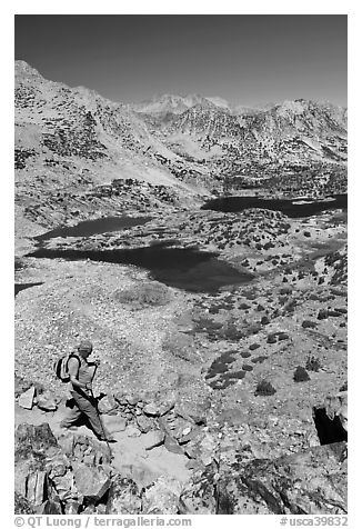 Hiker on trail above Saddlebag Lakes, John Muir Wilderness. Kings Canyon National Park, California