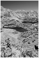 Hiker on trail above Saddlebag Lakes, John Muir Wilderness. Kings Canyon National Park, California (black and white)