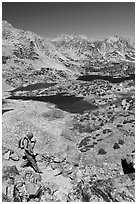 Hiker on trail above Saddlebag Lakes, John Muir Wilderness. Kings Canyon National Park, California (black and white)