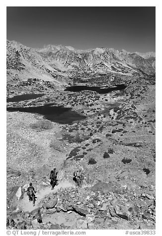 Hikers on trail above Saddlebag Lakes, John Muir Wilderness. Kings Canyon National Park, California