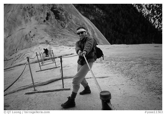 Hiker and cables on the regular route to Half-Dome. Yosemite National Park, California