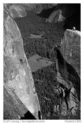 Climbers on Lost Arrow spire and Yosemite falls wall. Yosemite National Park, California