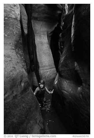 Canyoneer in tight and wet section of Das Boot Canyon. Zion National Park (black and white)