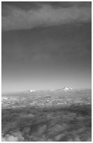 Mt Foraker and Mt Mc Kinley emerge from  sea of clouds. Denali National Park, Alaska, USA. (black and white)