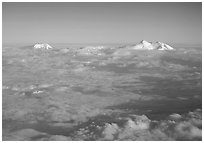 Summit of Mt Foraker and Mt Mc Kinley emerging from  clouds. Denali National Park, Alaska, USA. (black and white)