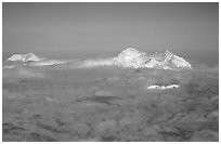 Mt Foraker and Mt Mc Kinley emerge from a sea of clouds. Denali National Park, Alaska, USA. (black and white)
