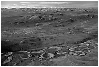 Aerial view of plain with meandering Alatna river and mountains. Gates of the Arctic National Park, Alaska, USA. (black and white)
