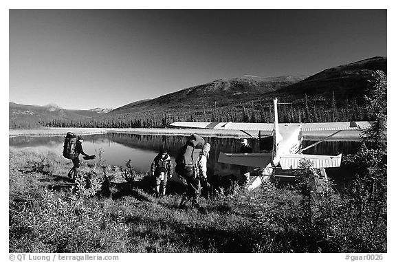 Backpackers beeing picked up by a floatplane at Circle Lake. Gates of the Arctic National Park, Alaska