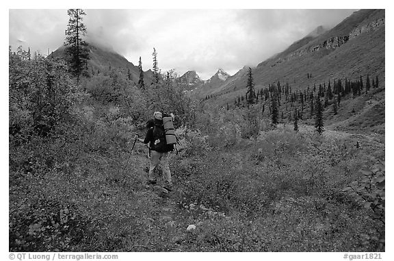 Backpacker in Arrigetch Creek. Gates of the Arctic National Park, Alaska