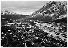 Boulders, valleys and slopes with fresh snow in cloudy weather. Gates of the Arctic National Park, Alaska, USA. (black and white)