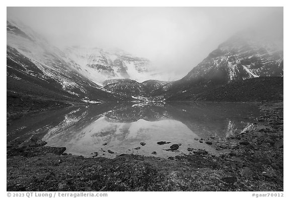 Lake and Three River Mountain emerging from the clouds. Gates of the Arctic National Park (black and white)