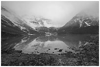 Lake and Three River Mountain emerging from the clouds. Gates of the Arctic National Park ( black and white)