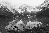 Snowy Three River Mountain reflected in lake. Gates of the Arctic National Park ( black and white)