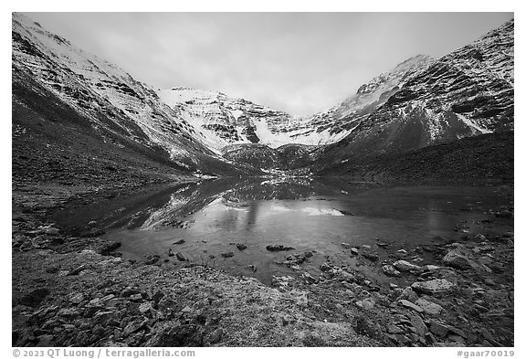 Partly frozen lake and Three River Mountain, dawn. Gates of the Arctic National Park (black and white)