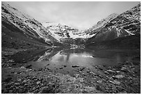 Partly frozen lake and Three River Mountain, dawn. Gates of the Arctic National Park ( black and white)