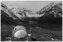 Lighted tent, lake, and Three River Mountain. Gates of the Arctic National Park ( black and white)