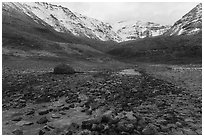 Field of angular rocks alternating with moss and Three River Mountain. Gates of the Arctic National Park ( black and white)