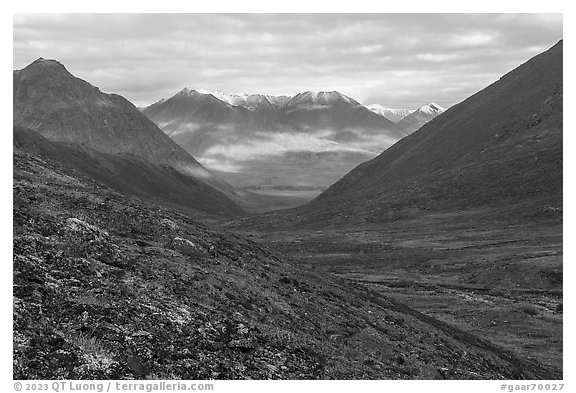 Valley with sunlit slopes in the distance. Gates of the Arctic National Park (black and white)