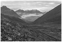 Valley with sunlit slopes in the distance. Gates of the Arctic National Park ( black and white)