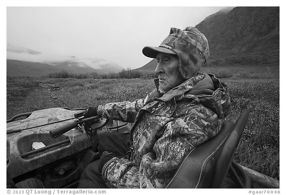 Nunamiut subsistence hunter driving all-terrain vehicle. Gates of the Arctic National Park (black and white)