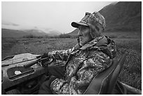 Nunamiut subsistence hunter driving all-terrain vehicle. Gates of the Arctic National Park ( black and white)
