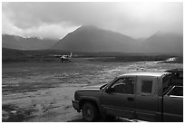 Truck waiting for airplane, Anaktuvuk Pass Airport. Gates of the Arctic National Park ( black and white)