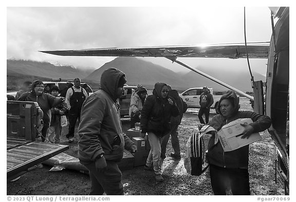 Unloading airplane, Anaktuvuk Pass Airport. Gates of the Arctic National Park (black and white)