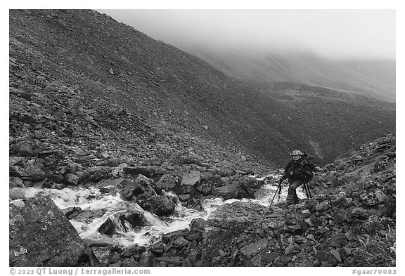 Hiker in rocky gorge, Three River Mountain. Gates of the Arctic National Park (black and white)