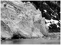 Kayaker dwarfed by Lamplugh glacier. Glacier Bay National Park ( black and white)