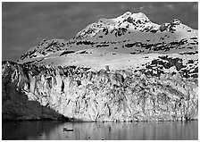 Face of Lamplugh Glacier illuminated by the sun on cloudy day. Glacier Bay National Park, Alaska, USA. (black and white)