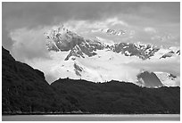 Dark ridge and cloud shrouded peaks, West Arm. Glacier Bay National Park, Alaska, USA. (black and white)