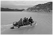 Film crew preparing for landing in a Zodiac. Glacier Bay National Park, Alaska, USA. (black and white)