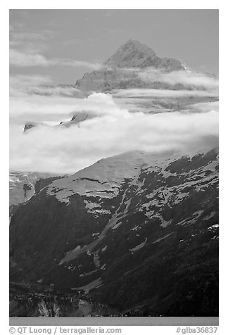 Pointed mountain with clouds hanging below. Glacier Bay National Park (black and white)