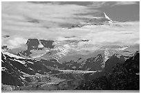 Pointed peaks of Fairweather range emerging from clouds. Glacier Bay National Park, Alaska, USA. (black and white)