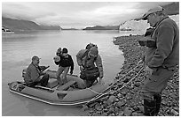 Film crew lands near Margerie Glacier. Glacier Bay National Park, Alaska, USA. (black and white)