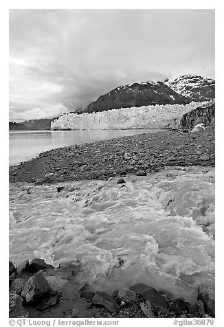 Stream flowing into Tarr Inlet, with Margerie Glacier in background. Glacier Bay National Park (black and white)