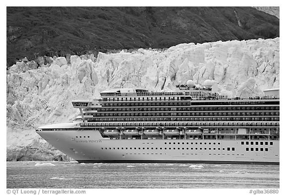 Cruise ship dwarfed by the face of Margerie Glacier. Glacier Bay National Park (black and white)