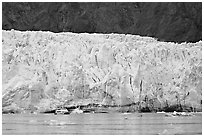 Small tour boat dwarfed by Margerie Glacier. Glacier Bay National Park ( black and white)