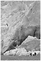 People at the base of the Reid Glacier terminus. Glacier Bay National Park, Alaska, USA. (black and white)