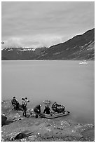 Film crew embarking on a skiff after shore excursion. Glacier Bay National Park ( black and white)