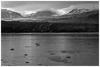 Icebergs and Grand Pacific Glacier under low clouds. Glacier Bay National Park ( black and white)