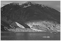 Sunset light falling on the base of the peaks around Tarr Inlet. Glacier Bay National Park, Alaska, USA. (black and white)