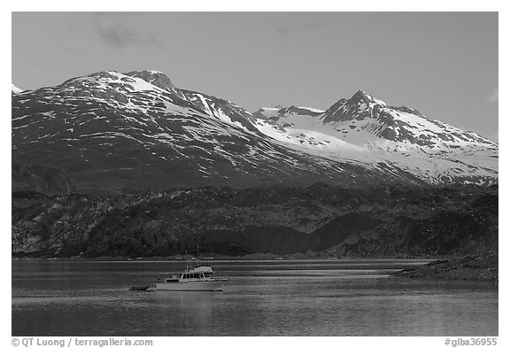 Small boat in Tarr Inlet, early morning. Glacier Bay National Park (black and white)