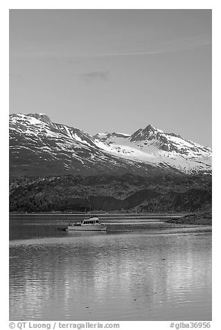 Small boat at the head of Tarr Inlet, early morning. Glacier Bay National Park, Alaska, USA.