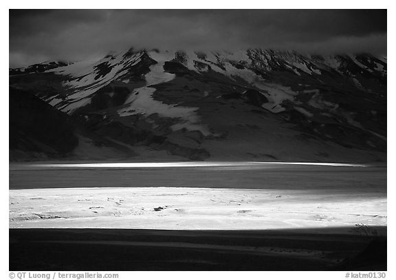 A break in the clouds illuminate the floor of the Valley of Ten Thousand smokes. Katmai National Park (black and white)