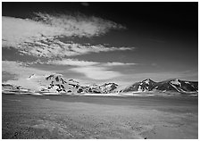 Snow-covered peaks surrounding the arid ash-covered floor of the Valley of Ten Thousand smokes. Katmai National Park, Alaska, USA. (black and white)