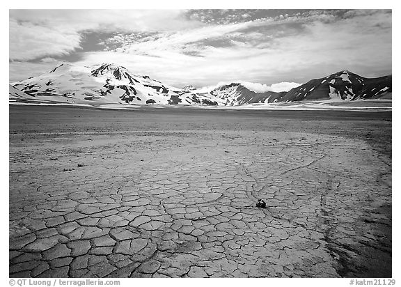 The desert-like floor of the Valley of Ten Thousand smokes is surrounded by snow-covered peaks such as Mt Meigeck. Katmai National Park (black and white)