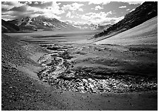 Stream flows from the hills into the floor of the Valley of Ten Thousand smokes. Katmai National Park, Alaska, USA. (black and white)